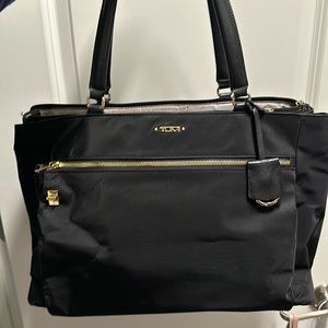 Beautiful Tumi tote bag water proof and gold trim. Perfect for work and travel